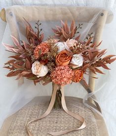 a bouquet of flowers sitting on top of a chair