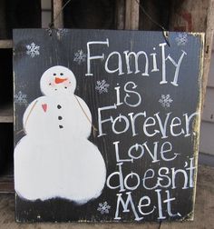 a wooden sign that says family is forever love doesn't melt snowman on it