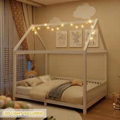 a bedroom with a canopy bed and string lights on the headboard is decorated in neutral colors