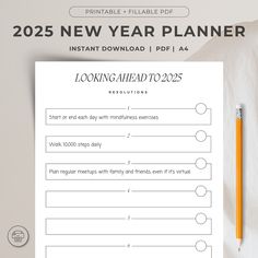 a printable new year planner next to a pencil