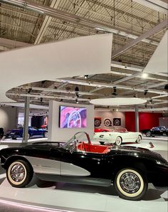 an antique car on display in a museum