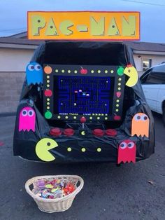 an arcade machine decorated to look like pacman