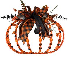 an orange and black pumpkin headband with beads