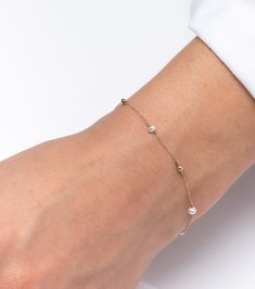 Buy a unique pearl station bracelet for women. | Discover a large collection of everyday sparkling jewels. | ✅ We offer FREE Worldwide Shipping. 📌About the bracelet: Our dainty station bracelet is made from 14 karats solid gold and has three pearls and three gold beads. It is a really shiny and sparkling bracelet that can be worn alone or as part of a layering set. Our bracelet is handcrafted to order, please allow 4 - 10 business days for shipping out. Need it sooner? Just ask and we will let Elegant Beaded Rosary Bracelet, Elegant Pearl Beaded Charm Bracelet, Elegant Pearl Rosary Bracelet With Round Beads, Elegant Beaded Rosary Bracelet For Gift, Dainty Bracelets With Extender For Formal Events, Dainty Bracelets With Extender For Formal Occasions, Dainty Beaded Bracelets With Round Beads For Bridesmaid Gift, Elegant White Beaded Bracelets With Adjustable Chain, Elegant White Beaded Bracelet With Adjustable Chain