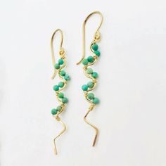 Dainty and delicate gold filled earrings with Authentic Kingman Turquoise from Arizona. Uniquely beautiful and carefully sourced. 1 3/4" drop length. Each pair is made to order and may vary slightly from photo. Elegant Handmade Turquoise Earrings, Turquoise 14k Gold Filled Earrings As Gift, Casual Turquoise Dangle Earrings, Turquoise 14k Gold Filled Earrings For Gift, Gift Turquoise 14k Gold Filled Earrings, Elegant Turquoise Earrings With Gold Beads, Elegant Turquoise 14k Gold Filled Earrings, Turquoise 14k Gold Filled Earrings, Turquoise 14k Gold Filled Drop Earrings