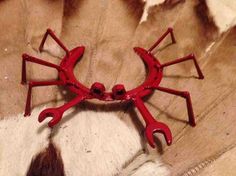 a dog laying on top of a rug covered in fake animals'legs and claws