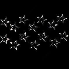 a group of white stars on a black background