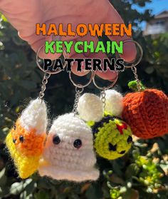 there are three crocheted keychains with pumpkins and ghost faces hanging from them