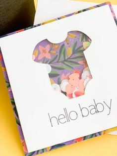 a card with the word hello baby on it and an image of a teddy bear