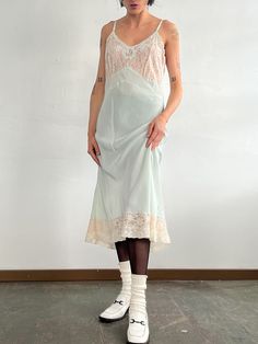 Vintage 60s/70s slip dress. Pale pastel green with cream lace details. Adjustable straps. Excellent vintage shape.MEASUREMENTS (in inches)36 in bust 34 in waist 50 in hips 47 in length MATERIALS Nylon, acetateHave a question? Email us All items are FINAL SALE. Vintage pieces are pre-loved and may come with minor flaws, condition will be noted in description. For questions or concerns, please Email us at hello@shopbanshee.com. If purchasing through Meta all policies still apply. Vintage Slip Dress Outfit, Slip Dress Outfit, Vintage Slip Dress, White Slip Dress, Cream Lace Dress, Vintage Slip, Vintage Slips, Lace Slip Dress, White Slip