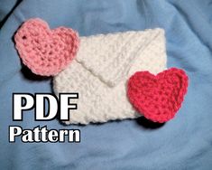 there is a crocheted bag with two hearts on it and the text, free pattern