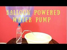 the balloon powered water pump is next to a white bowl with a straw in it