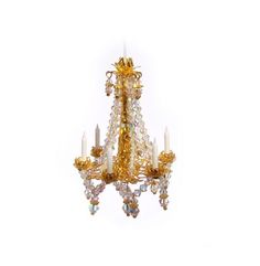 a golden chandelier hanging from the ceiling with crystal beads on it's sides