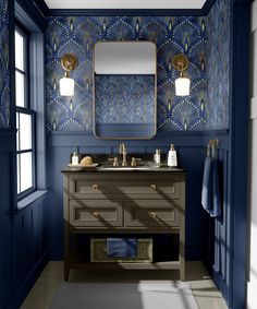 a bathroom with blue and gold wallpaper on the walls, two sinks and a mirror