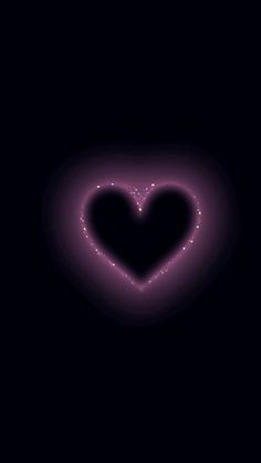 a black background with a purple heart in the center and small white dots around it