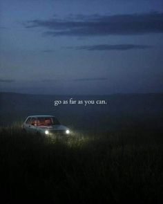 a car parked in the middle of a field at night with an inspirational quote above it