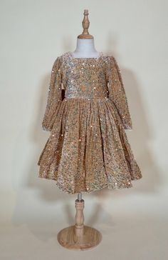 Girls long sleeved gold & champagne sequinned party dress complete with a back bow, tulle underskirt and zipper in the back lined with soft material, perfect for special occasions and holidays! ♥︎ Receive FREE domestic shipping when you spend $100 with code "FREESHIP100" ♥︎ For FREE local deliveries within London, Ont. use promo-code "LOCAL" at checkout Outfit Holiday, Tulle Underskirt, Gold Sequin Dress, Outfit Cute, Gold Champagne, Holiday Outfit, Dress Girls, Cute Outfit, Gold Sequin