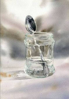 a glass jar with a spoon sticking out of it