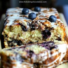 a loaf of blueberry coffee cake on a cutting board