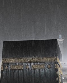 the ka'bah in the rain is black and gold