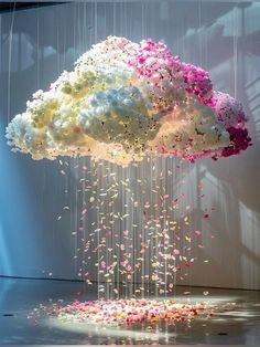 a cloud filled with flowers floating from the ceiling