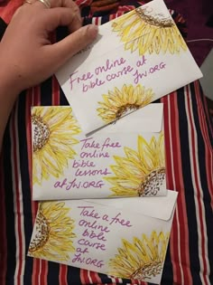 three pieces of paper with words written on them and sunflowers in the background