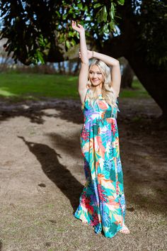 Our Gorgeous Tiered Maxi Dress is the perfect item to pack for your next tropical vacation! Featuring ric-rac detailing, adjustable straps, and a fun, vibrant tropical print tiered skirt that is designed to flow as easy as the sea breeze. Pair this beach dress with a trendy floppy hat, your favorite shades and wedge sandals for the perfect resort outfit! Item Description: Maxi Dress Tiered Hemline Square Neckline Tropical Print Ric Rac Trim Details Adjustable Tie Straps Fabric Content: 100% Poly Multicolor Tropical Print Sundress For Garden Party, Tropical Print Sundress For Garden Party, Tiered Multicolor Sundress For Vacation, Tropical Dress For Garden Party Vacation, Tropical Dresses For Garden Party Vacation, Tropical Style Dress For Garden Party And Vacation, Tropical Spaghetti Strap Dress With Tropical Print, Tropical Multicolor Sundress For Day Out, Tropical Maxi Sundress For Garden Party