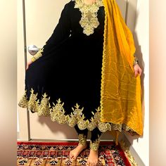 Available In Size M, Our Collection Is Designed To Cater To The Needs Of Modern Women Who Value Fashion And Culture. With A Focus On Traditional Designs And Styles, Our Clothing Is Perfect For Those Who Want To Stand Out From The Crowd. So Why Wait? Shop Now And Experience The Beauty Of These Cultural Clothes For Yourself! Traditional Black Party Dress, Black Anarkali Long Dress, Black Anarkali Dress With Fitted Waist, Black Fitted Anarkali Dress, Fitted Long Dresses With Dabka Detail, Fitted Black Dress With Dupatta, Elegant Black Dress With Dupatta, Black Long Sleeve Festive Dresses, Traditional Black Dress For Eid