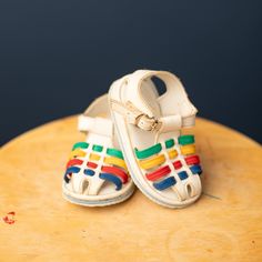 Vintage white and primary colour woven sandals for baby/toddler.  In good vintage condition. Some yellowing and signs of wear.  Size 5 (baby/toddler) *all sales final. Due to the nature of these items being second hand and vintage, Please expect slight signs of wear - after all these items have been loved before!  No returns/refunds. Refunds given on items damaged during shipping, or at shops discretion.  Please inspect all photos carefully or inquire for further info before purchasing if unsure Vintage White Closed Toe Sandals, Adjustable White Sandals For Playtime, Vintage White Open Toe Sandals, White Sandals With Soft Sole For Playtime, Playful Multicolor Sandals For Playtime, Adjustable Multicolor Sandals For Playtime, Multicolor Open Toe Sandals For Playtime, Playful Multicolor Sandals, Playful White Closed Toe Sandals