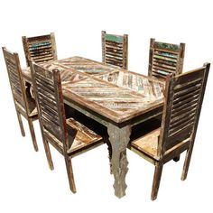 an old wooden table with six chairs around it