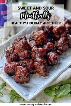 sweet and sour meatballs on a white plate with lettuce in the background