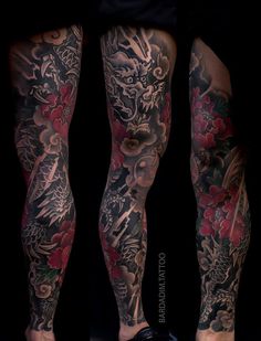 the legs are covered in tattoos and flowers