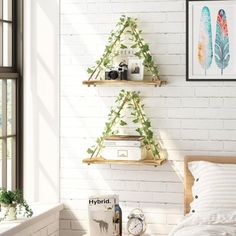 a bedroom with white brick walls and two wooden shelves on the wall, along with a bed