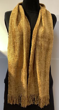 "Luxurious scarves handwoven in rich golds. The 100% rayon chenille fiber content provides rich colors, soft texture, and beautiful drape. Plus it is non-irritating to the skin. Both functional and fashionable. Hand wash, hang to dry, and steam iron. The gold scarf measures 9\" wide by 60\" long excluding fringe and the gold and yellow stripe is 7\" wide by 60\" long. The ends are secured with a tight zigzag machine stitch. I hand wash, dry, and iron all my scarves prior to shipping. Choose your Elegant Gold Scarf One Size, Gold Shawl For Fall, Elegant Gold Shawl For Winter, Elegant Gold Silk Scarf For Festive Occasions, Festive Gold Shawl Scarf, Gold Silk Shawl, Gold Scarf, Handwoven Scarf, Steam Iron