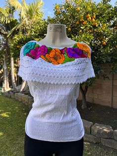 Beautiful off shoulders blouse with colorful floral embroidery. Lace trim blouse.  blouse size Smal-Medium. White Boho Collar Top, Bohemian Off-shoulder Top With Floral Embroidery, Fitted White Tops With Boho Collar, White Fitted Top With Boho Collar, White Embroidered Off-shoulder Top, White Tops For Summer Fiesta, White Top For Spring Fiesta, White Bohemian Top For Cinco De Mayo, White Cotton Top For Fiesta