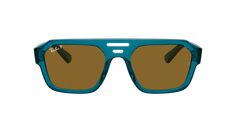 Experience the perfect blend of style and sustainability with Ray-Ban Corrigan Bio-Based sunglasses. These irregular-shaped glasses feature a polished transparent light blue acetate frame that contrasts beautifully with the dark brown polarized lenses. The shades not only look great but also offer superior protection from the sun's rays. Embrace a more eco-friendly lifestyle while remaining fashion-forward with these unique shades. Modern Blue Square Frame Sunglasses, Modern Blue Sunglasses With Uv Protection, Modern Blue Sunglasses For Pool, Blue Wayfarer Sunglasses In Polycarbonate, Retro Blue Wayfarer Sunglasses, Blue Glass Sunglasses With Uva Protection, Retro Blue Square Frame Sunglasses, Modern Blue Polycarbonate Sunglasses, Modern Light Blue Tinted Sunglasses