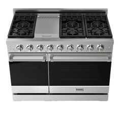 an oven with four burners and two doors on the front, in stainless steel