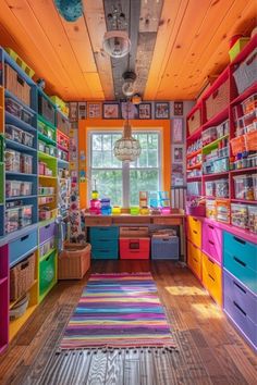 this colorful room has lots of bookshelves and drawers