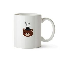 a white coffee mug with a brown bear wearing a black hat and the words papa on it