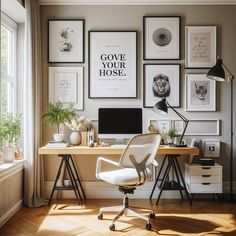 a home office with posters on the wall