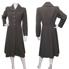 A fabulously utilitarian wartime 1940s coat in a grey wool cloth with rayon fastening.  The waist is shaped with elegant seaming and the shoulders are heavily padded.  There are buttons at the front and I feel these may be replacements, but they are of the period.  The lining has some utterly adorable patched repairs and a split at the seam of the armhole (lining only) and another at the centre of the neck.  There is a surface nibble at the side seam.  There is some minor fade/ discolouration at Formal Fitted A-line Wool Coat, Vintage Gray Outerwear With Buttons, Vintage Fitted Wool Coat Single Breasted, Fitted Vintage Single-breasted Wool Coat, Vintage Wool Coat With Buttons For Formal Occasions, Vintage Formal Wool Coat, Fitted Vintage Wool Coat For Work, Elegant Gray Wool Coat With Buttons, Classic Fitted Gray Wool Coat