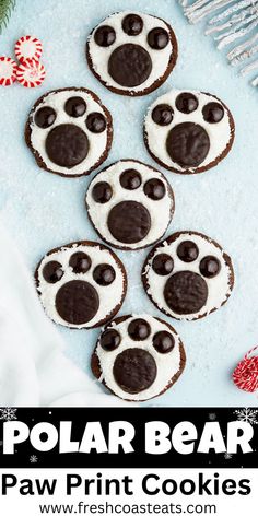 An image of polar bear paw print cookies on a light blue background. Polar Bear Paw Print, Bear Paw Cookies, Kid Friendly Cookie Recipes, Winter Themed Desserts, Paw Print Cookies, Bear Themed Party, Santa Desserts, Polar Bear Paw