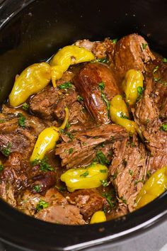 the meat and peppers are being cooked in the slow - cooker to be eaten