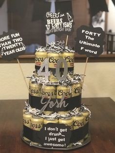 a birthday cake made to look like it has cans of beer stacked on top of each other