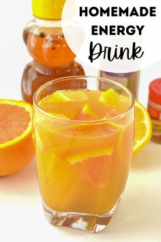 homemade energy drink with oranges and honey in the background, text overlay reads homemade energy drink