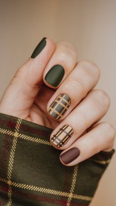 These cool plaid fall nails are perfect for anyone looking for October nail inspo. Featuring classic fall colors like green, mustard, and brown, with both matte and glossy finishes, this fun nail design is perfect for acrylic nails and those loving dark fall nails this season. Dark Fall Short Nails, Cool Short Nails Fall, Plaid Fall Nails Ideas, Brown And Gray Nails, Fall Nails Greens, November Nail Inspiration, November Nails Ideas Short Square, Fall Season Nails Green, Sage Colored Nails