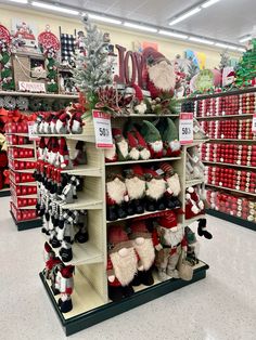 a store filled with lots of christmas decorations and santa hats on the shelves in front of them