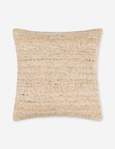 a beige pillow on a white background