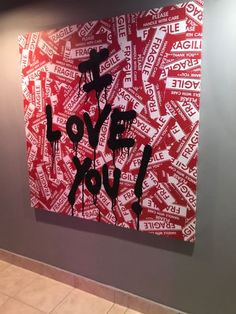 a red and white painting with the words love you on it