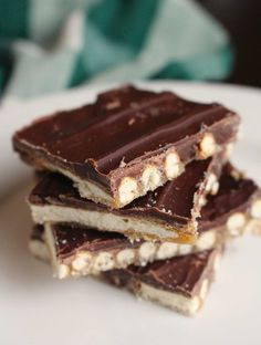 chocolate and marshmallows are stacked on top of each other in the shape of squares